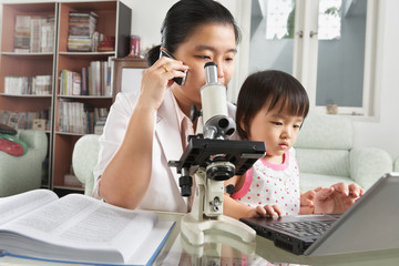 Busy mother try to play with her daughter