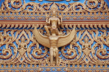 Fototapeta na wymiar art on gable of temple, Wat Kwan Muang, Borabue, Mahasarakam