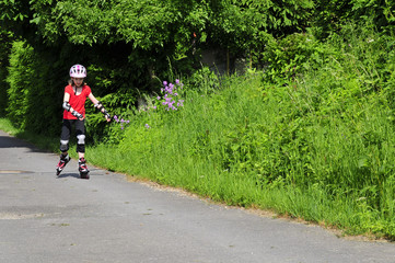 Fototapeta premium Inline Skating Kind Mädchen Sommer