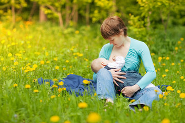 Fototapeta na wymiar Little baby girl breast feeding