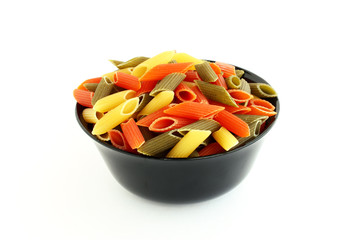 Colored pasta in black bowl