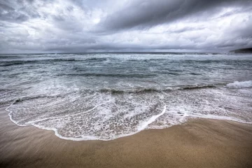 Fotobehang stormy beach © Tommaso Lizzul