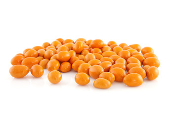 orange peanuts over white background