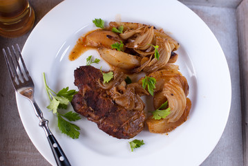 Braised pork chop with potatoes and onion