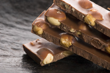 Pile of broken chocolate with nuts