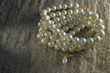 pearl necklace on the stone
