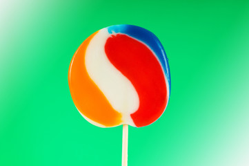 Colourful lollipop against the colourful background