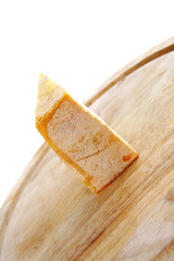 piece of cheese on board