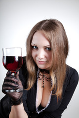 Sensual woman with glass of wine