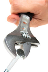 wrench with the screw in his hand