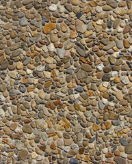 concrete with gray white orange brown stone pebbles wall