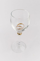 wedding rings in wine-glass