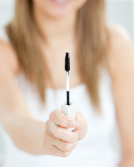 Close-up of woman holding make-up