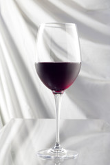 Glass with Red Wine on White Background