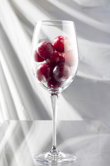 Glass with Grapes on White
