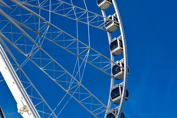 Foto auf Acrylglas big ferris wheel on blue sky background © dvoevnore
