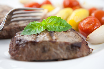 Close-up of grilled steak with vegetables