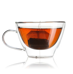 Teabag in the cup with hot water