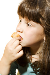 Young girl eating a doughnut. studio shoot
