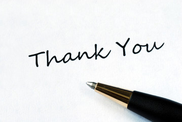 Ball pen on white background showing Thank You