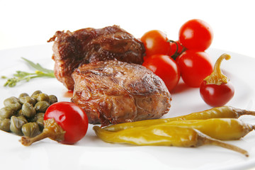grilled meat medallion with cherry tomatoes