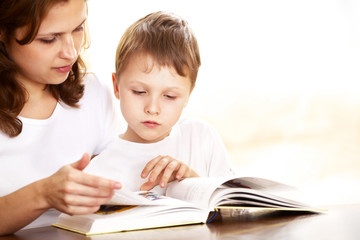 mother with her son reading