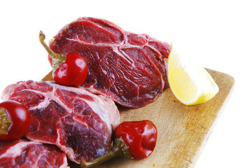 raw beef medallion on wood