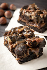 Chocolate brownie caramel sauce and nuts