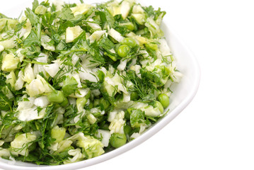 Fresh salad from vegetables and greens on a plate