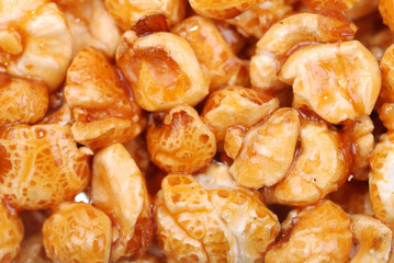 Background from sweet popcorn in honey