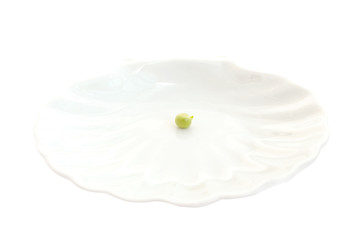 Pea on a white plate