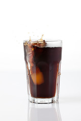 cola splash with ice