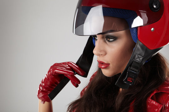 The beautiful girl with a motorcycle helmet
