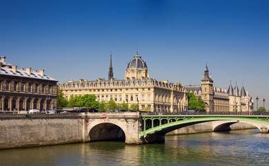 Fototapeta na wymiar View of Palais de Justice and a bridge over the Seine river. Par