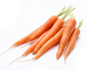 Ripe fresh carrots on a white background.