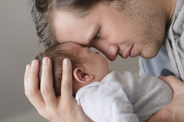 Fototapeta premium Father with newborn baby