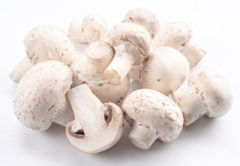 Handful of champignons on a white background