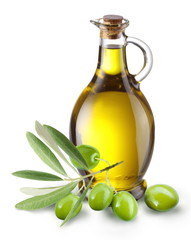 Branch with olives and a bottle of olive oil isolated on white - obrazy, fototapety, plakaty