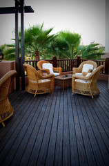 interior. armchair and table on balcony.