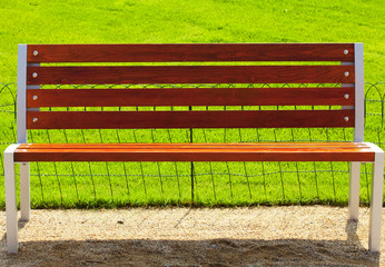 bench against a background of green grass