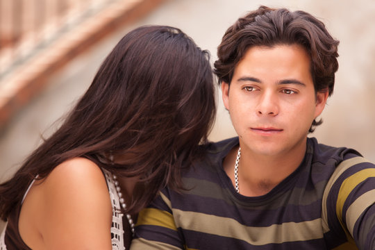 Attractive Hispanic Couple During A Serious Moment