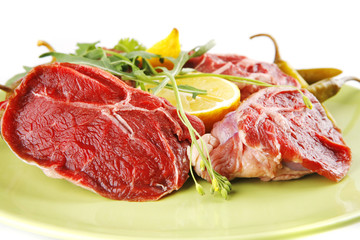 raw beef medallion on green