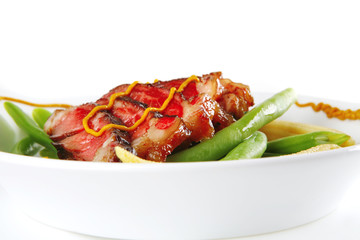 beef meat served with mustard