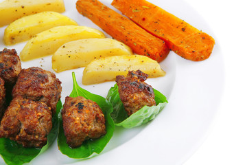 served meatballs on basil leaf