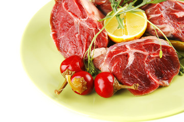 uncooked meat medallion on green