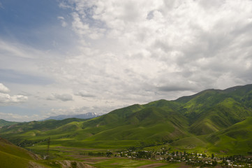 Fototapeta premium small village near high mountains