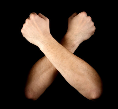 Two fists isolated on black background