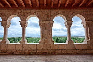 Landscape seen through romanesque church archs