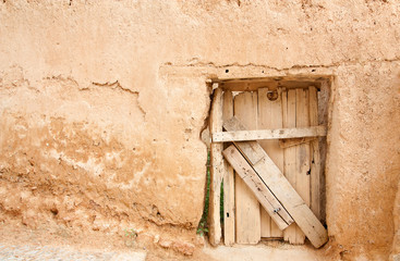 Rustic door and adobe wall