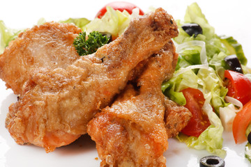 Roasted chicken legs with salad